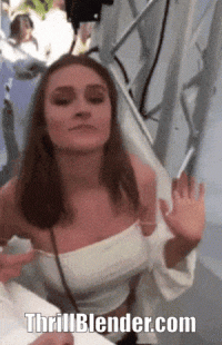 funny-girl-sprayed-with-water-loses-top-gif.gif